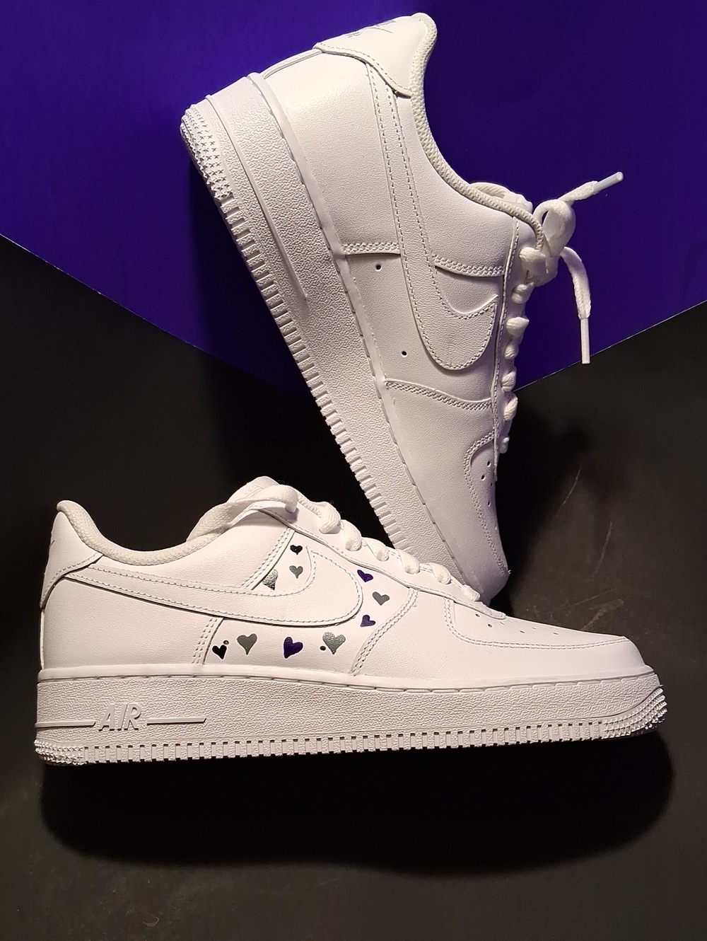 Nike Air Force 1s White Low-Top Sneakers with Black and Purple Heart Accents